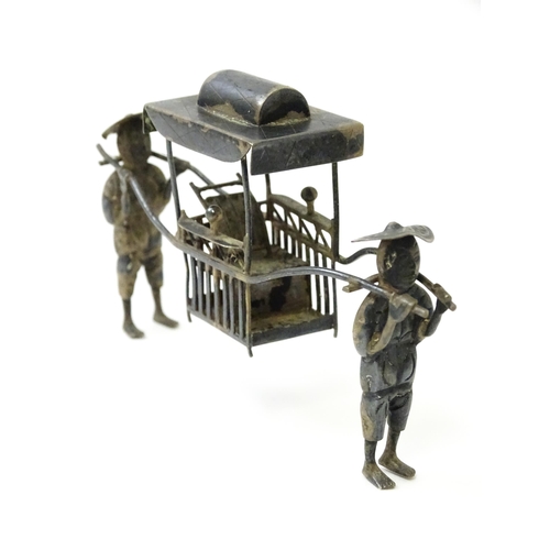 397 - A Chinese export silver model of two figures carrying a sedan chair. Marked with Oriental character ... 