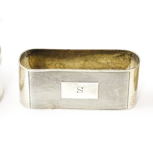 399 - Five assorted silver napkin rings to include a pair hallmarked Birmingham 1973, maker W I Broadway &... 