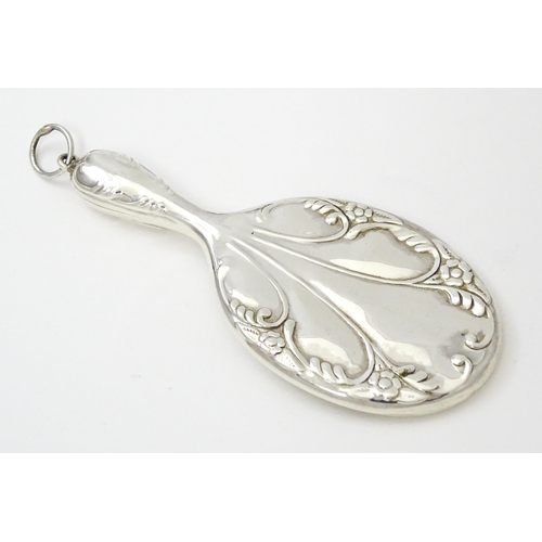 405 - A miniature .925 silver hand mirror. Approx. 2 3/4