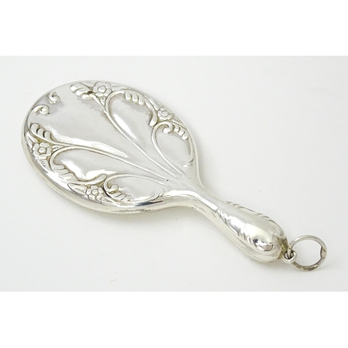 405 - A miniature .925 silver hand mirror. Approx. 2 3/4