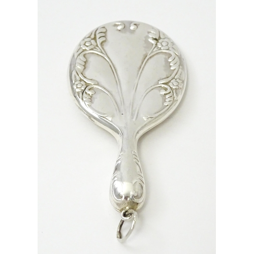 405 - A miniature .925 silver hand mirror. Approx. 2 3/4