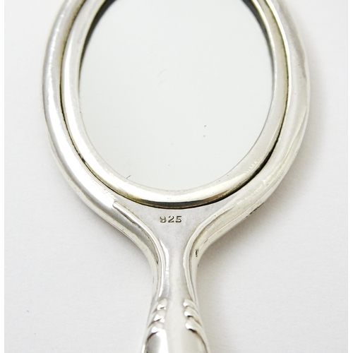 405 - A miniature .925 silver hand mirror. Approx. 2 3/4