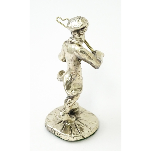 408 - A white metal model of a man playing the fiddle in the manner of Ben Zion. Approx. 2 3/4