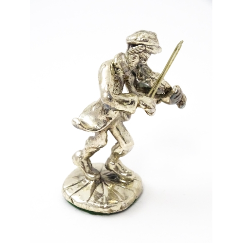 408 - A white metal model of a man playing the fiddle in the manner of Ben Zion. Approx. 2 3/4