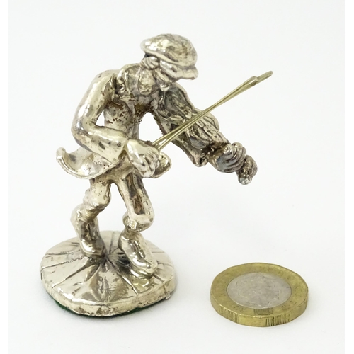 408 - A white metal model of a man playing the fiddle in the manner of Ben Zion. Approx. 2 3/4