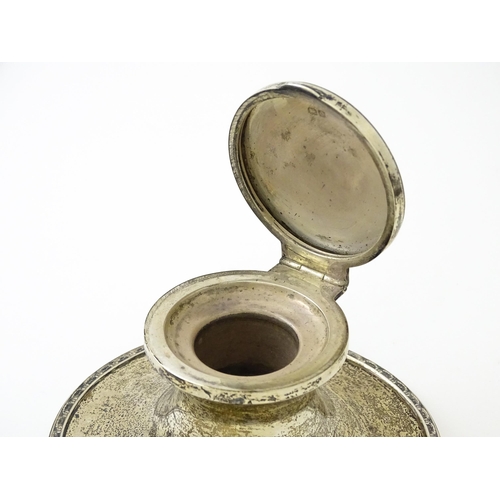 410 - A silver inkwell of capstan form with military inscription to top 'Wing Commander D. W. Edmonds D.F.... 