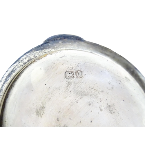 410 - A silver inkwell of capstan form with military inscription to top 'Wing Commander D. W. Edmonds D.F.... 