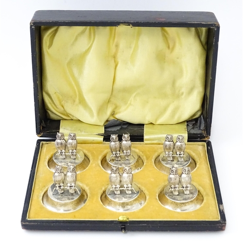 411 - A cased set of six novelty silver owl menu / place card holders, modelled as a pair of owls, hallmar... 