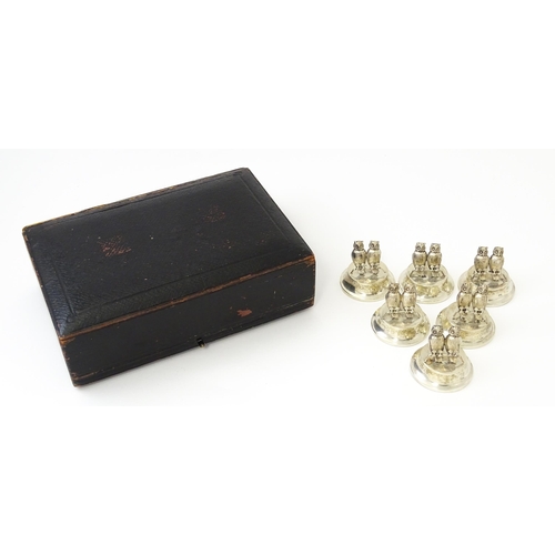 411 - A cased set of six novelty silver owl menu / place card holders, modelled as a pair of owls, hallmar... 