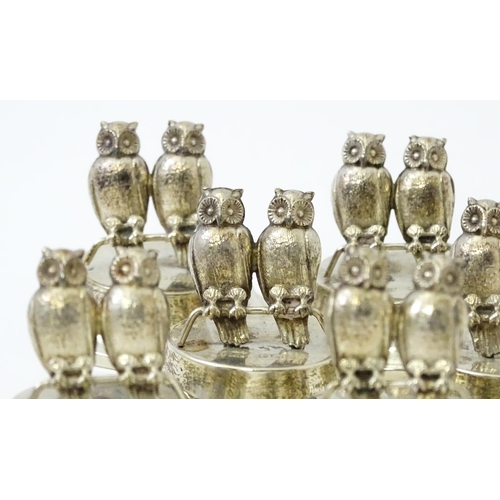 411 - A cased set of six novelty silver owl menu / place card holders, modelled as a pair of owls, hallmar... 