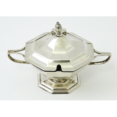 412 - A silver twin handled mustard pot hallmarked Sheffield 1909, maker Roberts & Belk. Approx. 2 1/2