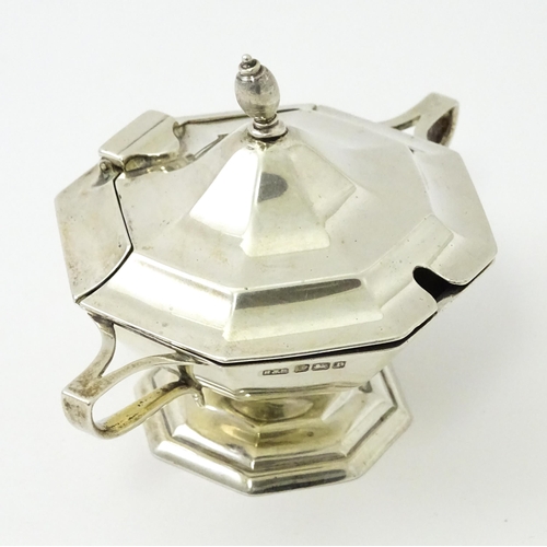 412 - A silver twin handled mustard pot hallmarked Sheffield 1909, maker Roberts & Belk. Approx. 2 1/2