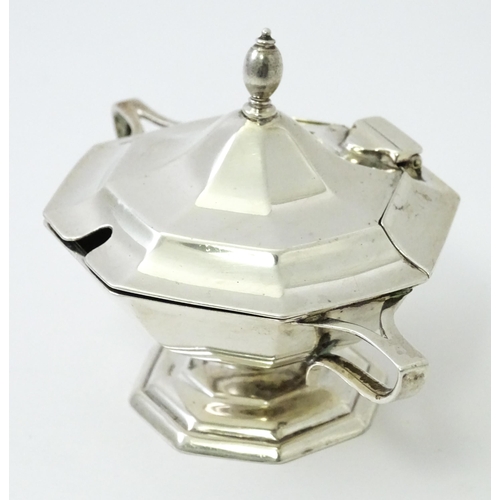 412 - A silver twin handled mustard pot hallmarked Sheffield 1909, maker Roberts & Belk. Approx. 2 1/2