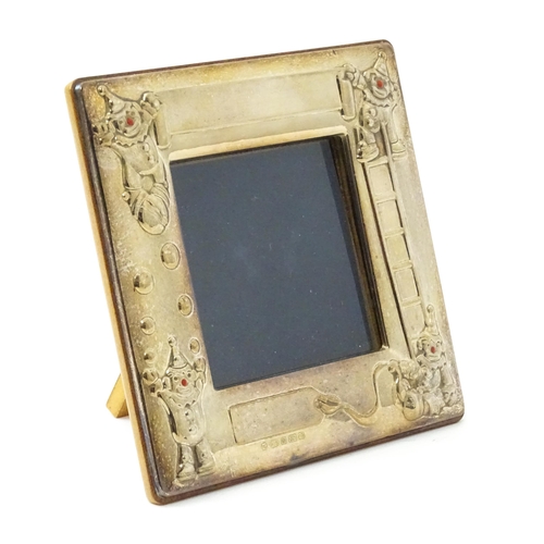 419 - An easel back photograph frame of squared form with clown detail, hallmarked Sheffield 2006, maker C... 