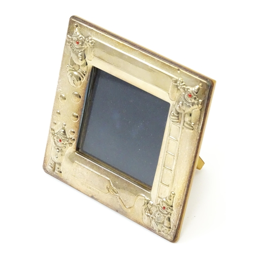 419 - An easel back photograph frame of squared form with clown detail, hallmarked Sheffield 2006, maker C... 