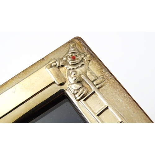 419 - An easel back photograph frame of squared form with clown detail, hallmarked Sheffield 2006, maker C... 