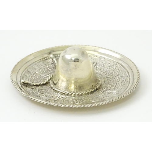 420 - A Mexican silver ring tree / holder formed as a Sombrero hat. Approx. 2 1/2