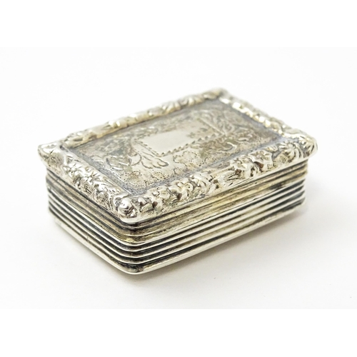 421 - A George IV silver vinaigrette opening to reveal a gilded interior with grille, hallmarked Birmingha... 