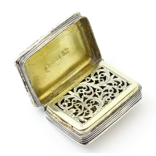 421 - A George IV silver vinaigrette opening to reveal a gilded interior with grille, hallmarked Birmingha... 