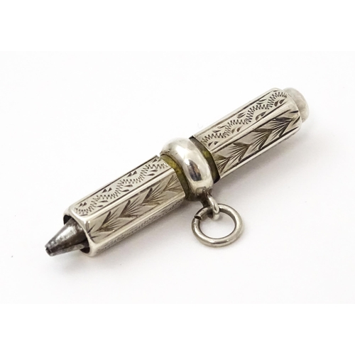 422 - A sterling silver propelling pencil with engraved decoration. Approx. 1 1/2