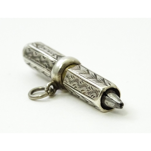 422 - A sterling silver propelling pencil with engraved decoration. Approx. 1 1/2