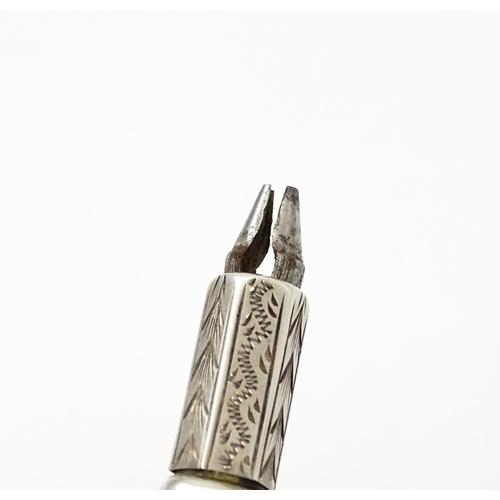 422 - A sterling silver propelling pencil with engraved decoration. Approx. 1 1/2