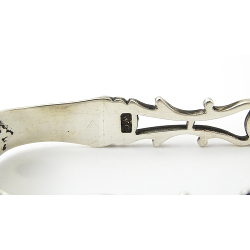 424 - 18thC silver sugar tongs with openwork decoration and acorn grips, maker W.C. Approx. 5 1/2