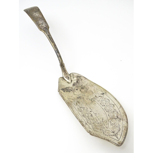 425 - An Irish silver fish slice with engraved decoration and engraved armorials to handle hallmarked Dubl... 