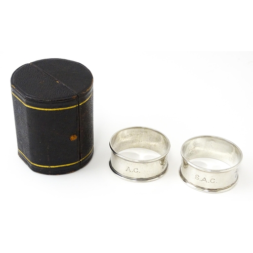 426 - A cased pair of Victorian silver napkin rings with engraved decoration hallmarked Sheffield 1885, ma... 