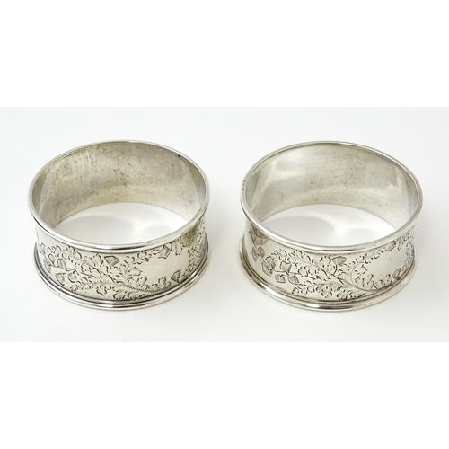 426 - A cased pair of Victorian silver napkin rings with engraved decoration hallmarked Sheffield 1885, ma... 