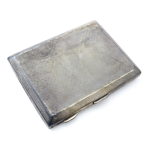 427 - An Art Deco silver cigarette case with engine turned decoration hallmarked Chester 1928, maker E. J ... 