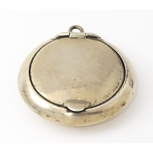 428 - A small silver compact / pill box with gilded interior and mirror within, hallmarked Birmingham 1920... 