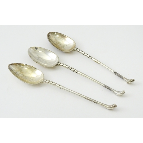 429 - Three silver teaspoons with golf club detail to handle, two hallmarked Sheffield 1972, maker Cooper ... 