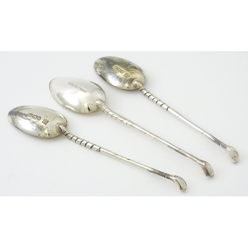 429 - Three silver teaspoons with golf club detail to handle, two hallmarked Sheffield 1972, maker Cooper ... 