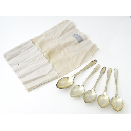 432 - Scandinavian Silver : Four Georg Jenson silver dessert spoons with beaded detail dated 1929 / 1932. ... 