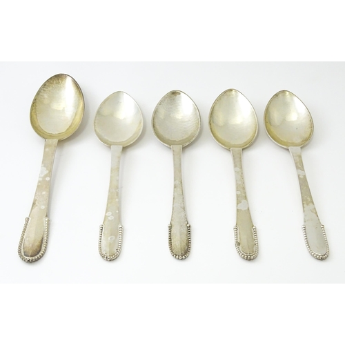 432 - Scandinavian Silver : Four Georg Jenson silver dessert spoons with beaded detail dated 1929 / 1932. ... 