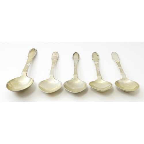 432 - Scandinavian Silver : Four Georg Jenson silver dessert spoons with beaded detail dated 1929 / 1932. ... 