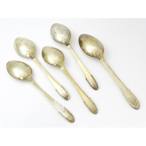 432 - Scandinavian Silver : Four Georg Jenson silver dessert spoons with beaded detail dated 1929 / 1932. ... 