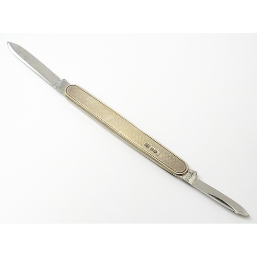 442 - A silver twin blade penknife with engine turned decoration hallmarked Sheffield 1966, maker W. Mills... 