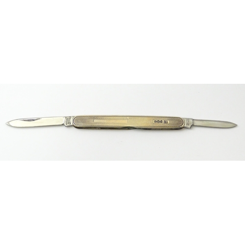 442 - A silver twin blade penknife with engine turned decoration hallmarked Sheffield 1966, maker W. Mills... 