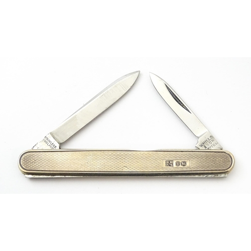 442 - A silver twin blade penknife with engine turned decoration hallmarked Sheffield 1966, maker W. Mills... 