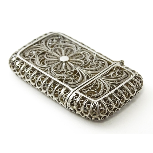 445 - A white metal vesta case with filigree decoration. Approx. 2 1/4