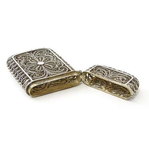 445 - A white metal vesta case with filigree decoration. Approx. 2 1/4