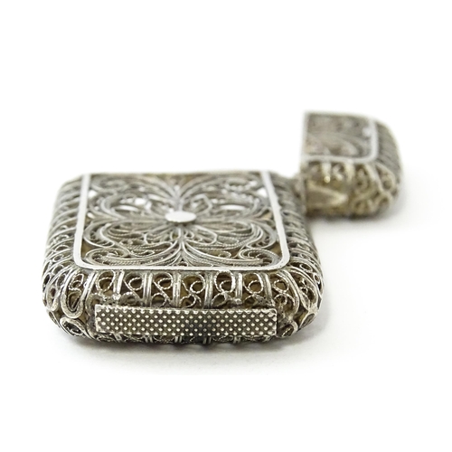 445 - A white metal vesta case with filigree decoration. Approx. 2 1/4