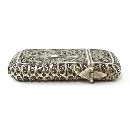 445 - A white metal vesta case with filigree decoration. Approx. 2 1/4