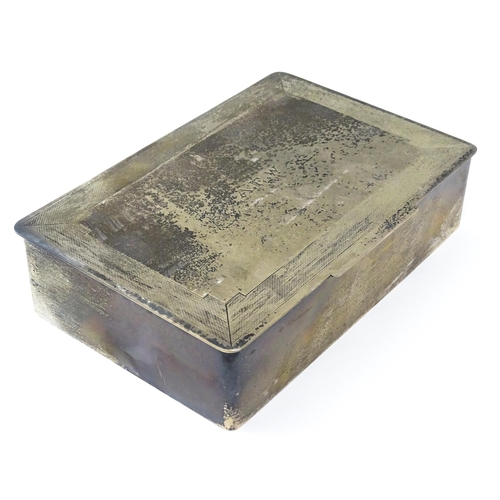 446 - An Art Deco silver cigarette box with engine turned decoration, opening to reveal a wood lined inter... 