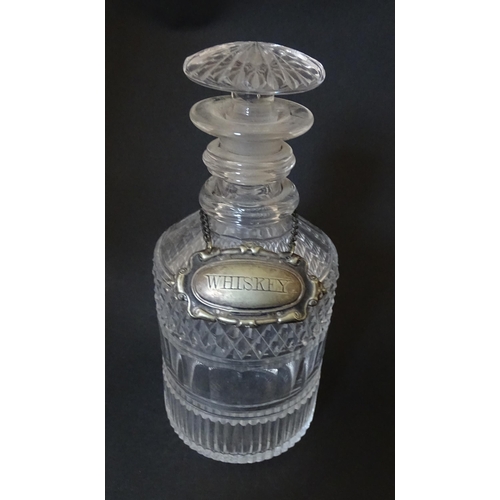 268 - A small 19thC three ring glass decanter with silver plate label. Approx. 7 1/2