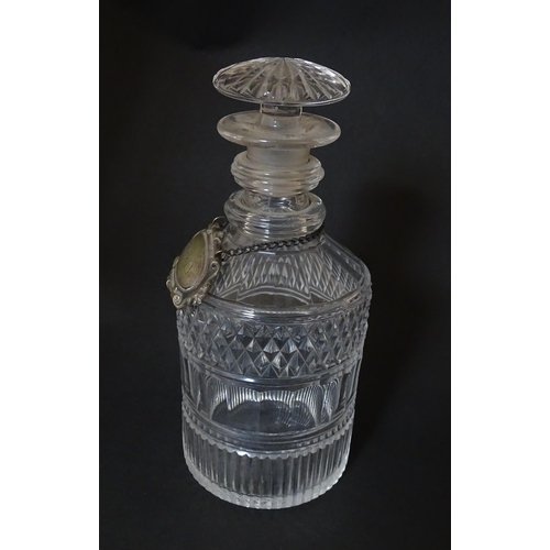 268 - A small 19thC three ring glass decanter with silver plate label. Approx. 7 1/2