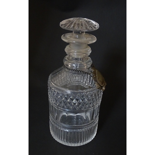 268 - A small 19thC three ring glass decanter with silver plate label. Approx. 7 1/2