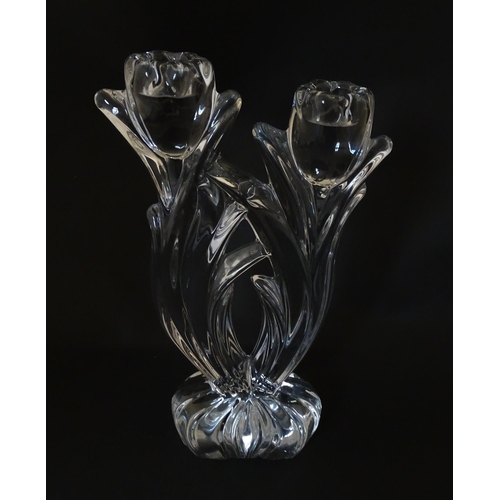 287 - A French glass double candlestick formed as stylised tulips. Bearing mark under for Cristal France. ... 